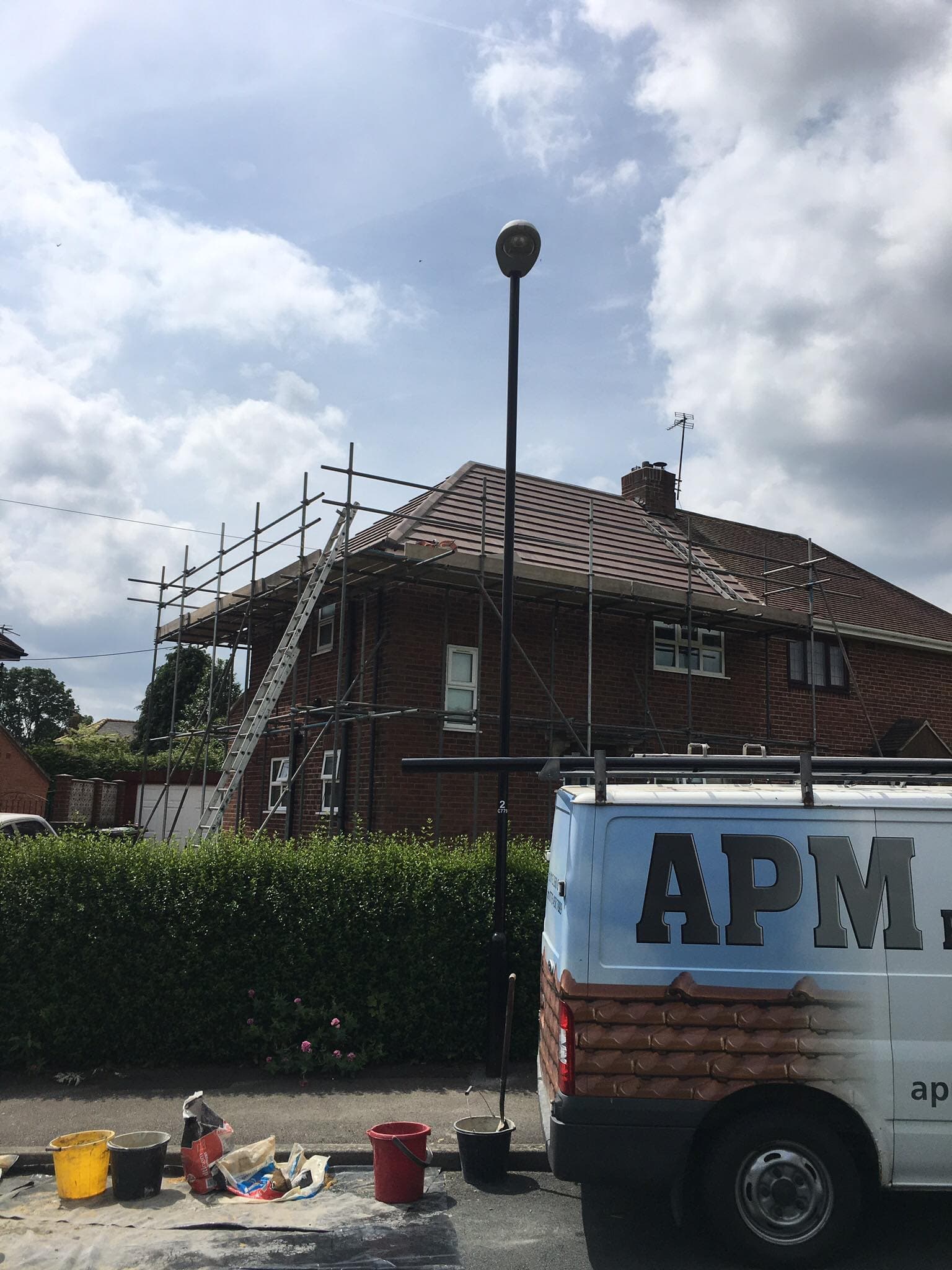 APM Roofing van and scaffolding at a new roof job in Leeds